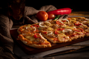 Closeup of delicious pizza with peppers and onions.