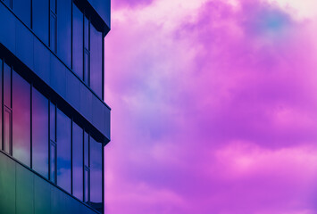 Minimalistic abstract background with generic commercial building and cloudy sky painted in pastel...