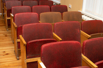 Rows of chairs in an empty conference room