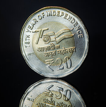 Indian ruppee commemorative coin on a black background