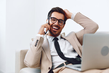 Man talk video smile phone businessman laptop portrait cellphone computer winner smartphone office workplace call