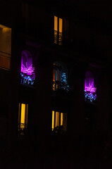Resedantial building windows decorated with Christmas lights, France