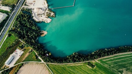 Aerial view of a beautiful lake near a field