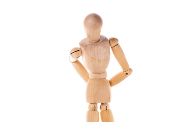 A wooden mannequin stands confidently with his hands on his hips. This versatile image can be used to represent assertiveness, confidence, fashion, design, or creativity.