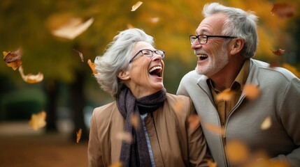 Obraz premium A modern elderly couple is walking in the forest. Smiling people.