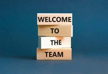 Welcome to the team symbol. Concept words Welcome to the team on wooden block. Beautiful white table white background. Business, motivational and welcome to the team concept.