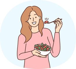 Smiling woman eating salad