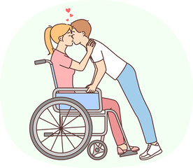 Obraz premium Man kissing disabled woman in wheelchair