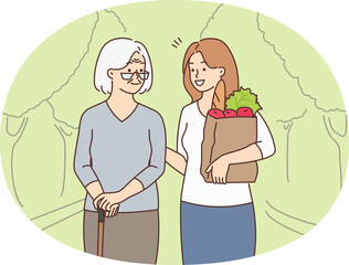 Girl with groceries help old grandmother