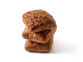 Three square Swedish bourget buns, with seeds on a white background