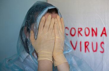 Woman in a protective suit closing her face.