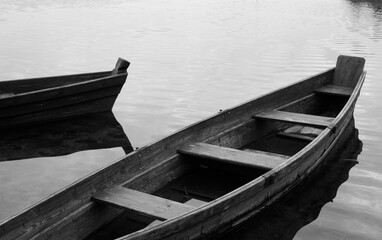 Old broken wooden boats filled with water