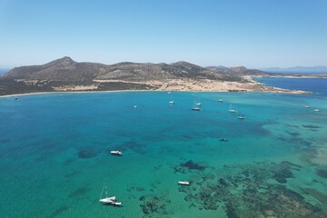 Fototapeta na wymiar Aerial views from over the Greek Island of Antiparos, looking out towards the adjacent island of Despotiko