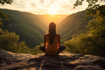 Healthy lifestyle, states of mind concept. Woman meditating or making yoga in dense jungles and illuminated with sun light - obrazy, fototapety, plakaty