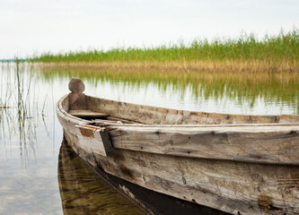 Old wooden boat in a lake