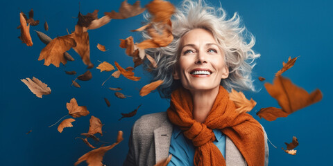 Obraz na płótnie Canvas Captivating Older Woman Amidst Falling Autumn Leaves, AI generated