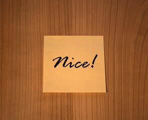 Post-it note Nice! wooden background