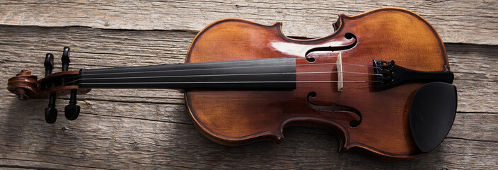 classical violin on wooden table