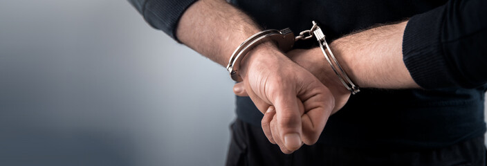 man hand handcuffs