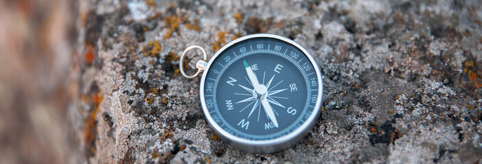 Magnetic compass on a stone