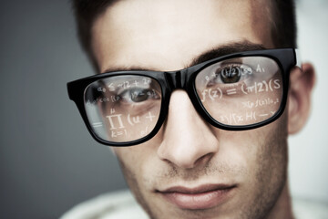 Portrait, glasses and formula with a man programmer closeup in studio on a gray background for...