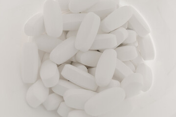 White pills in a jar
