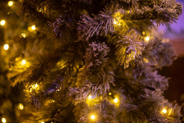 Obraz na płótnie Canvas Christmas background with bokeh, Christmas trees and decorations, soft focus, space for text