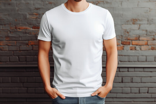 Man wearing plain white t-shirt for mockup. Fashion model male with white shirt and neutral background. White t-shirt mockup.