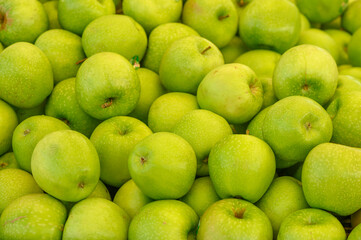 fresh appetizing green apples at the bazaar on the island of Cyprus in autumn 1