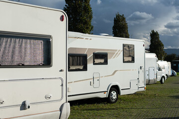 Motorhome parking. Warm sun on a gray afternoon