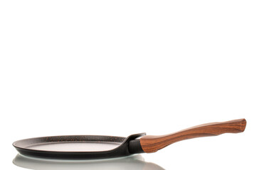 One metal pancake pan, macro, isolated on white background.
