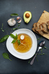soup with pasta and herbs. Close-up