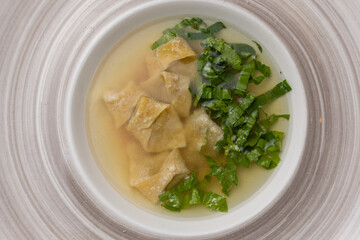 soup with pasta and herbs. Close-up