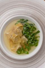 soup with pasta and herbs. Close-up