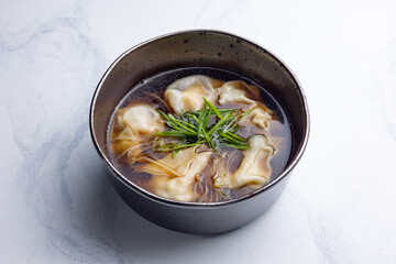 soup with pasta and herbs. Close-up