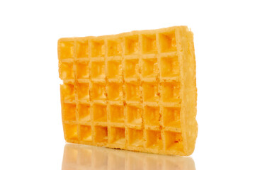 One freshly baked aromatic waffle, macro, isolated on white background.