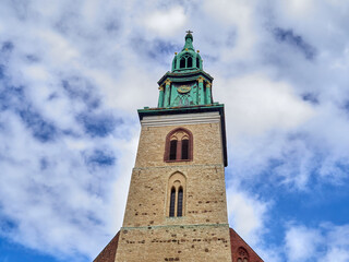 Fototapeta na wymiar Bell Tower of St. Mary's Church, known as the Marienkirche or St.-Marien-Kirche in German. Mitte, near Alexanderplatz, Berlin, Germany, Europe