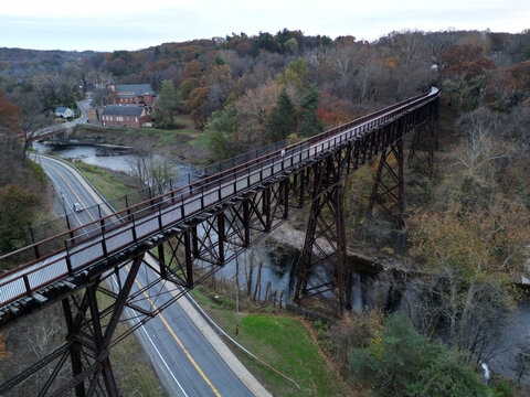 view of rosendale trestle passing over rondout creek at dusk (sunset, low light) old railroad bridge converted to bike, pedestrian path (cycling, biking, walking, jogging, walkill valley rail trail)