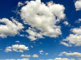 there are soft fluffy clouds in the sky