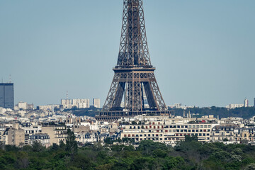 Panoramic view from with buildings (flats) and the Eiffel Tower (Tour Eiffel) in Paris, France on July, 16, 2023.
