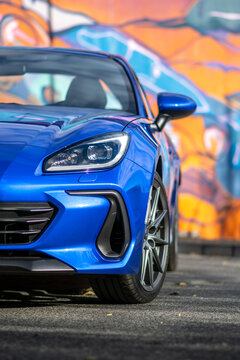 Blue sports car Subaru BRZ. Sports fast car. Front detail and headlight.