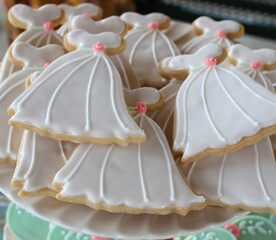 Closeup shot of beautiful wedding dress cookies on a bakery stall