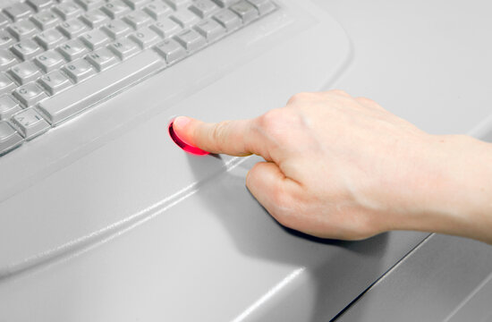 pharmacist selects medicine from hospital medicine automation system by scanning her finger. Pyxis drug station, automation system