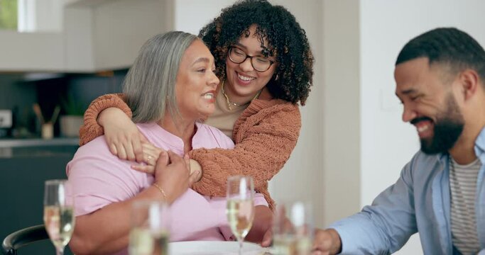 Hug, senior mother and woman at table with family, love and support in retirement or lunch. Happy, mothers day and people embrace in home with care at holiday, dinner or celebration together at party