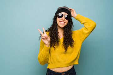 Young woman having fun with sunglasses enjoying the fall