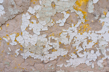 Old peeling paint on the wall. Abstract background.