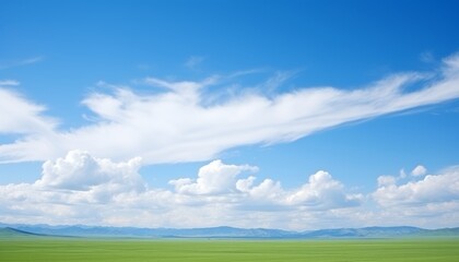 Fototapeta na wymiar idyllic rural landscape vast green fields and serene blue sky with fluffy white clouds