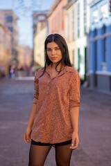 Fototapeta premium A stylish woman in modern city fashion standing in urban setting.