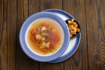 Seafood and herb soup. Close up