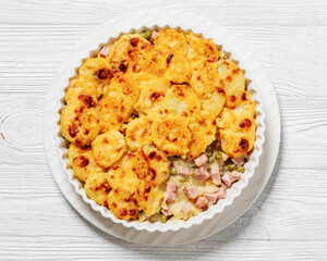 au gratin potatoes with diced ham and green peas